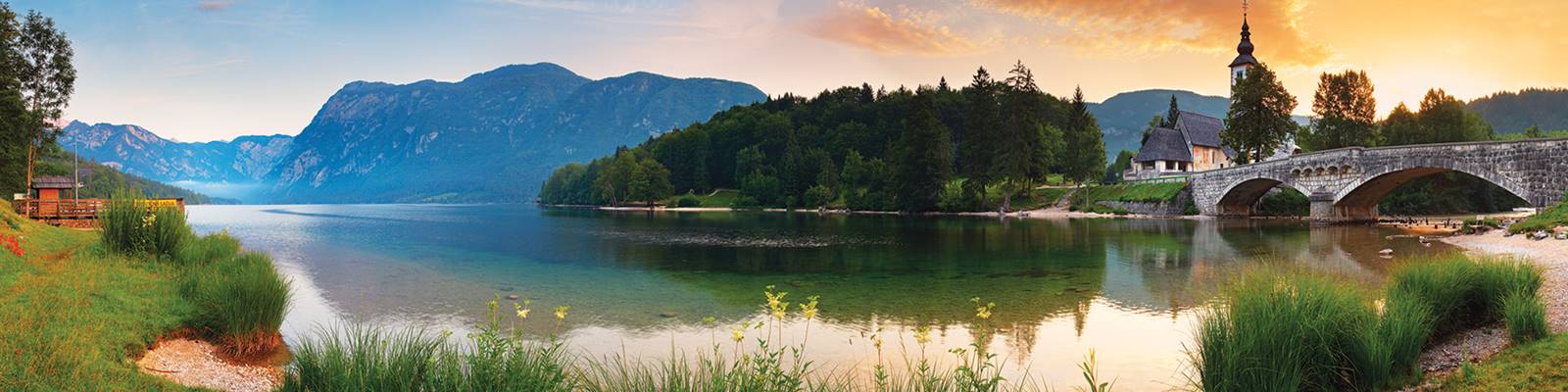 Mountains overlooking lake in SLOVENIA